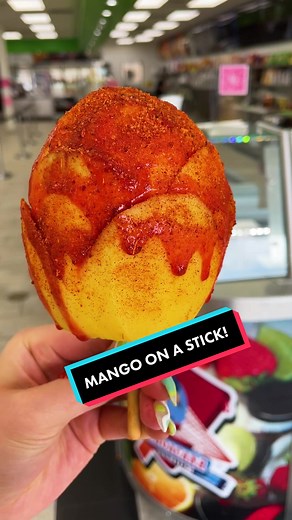 MANGO ON A STICK! Served with plenty of Chamoy and Tajín at La Michoacana Premium!! #mangotiktok #chamoy #tajin