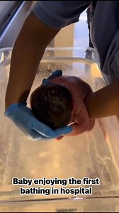 Baby enjoying the first bathing in hospital | Newborn babies