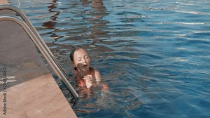 Caucasian Teen Girl Swimming Underwater in Pool. Beautiful Teenager Relax at Resort. Summer Vacation. Pretty Kid Dive, Come out, Looking at Camera and Smile. Happy Young Beauty in Swimsuit Wade Stock Video