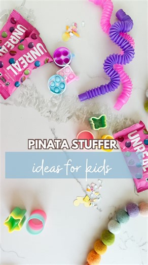 Emily Price on Instagram: "Come stuff a pinata with me! Here is what to stuff your kid’s pinata with that isn't just candy. I started with lots of fidget toy options. Pop its, slinkies, and the noise spring, and I had to include my favorite unreal candy. I know this is just junk that parents may not like, but I loved the pinata at birthday parties when I was a kid. Pinata stuffers, what to put in a pinata, diy pinata, disneyland party"