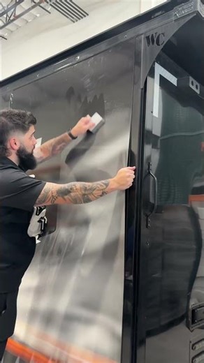 Custom printed wrap install on this car hauler trailer