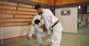Fight, teacher and martial arts in dojo for karate, kung fu and practice with fitness, people and learning. Training, submission and workout for exercise, class and self defense with student in Japan