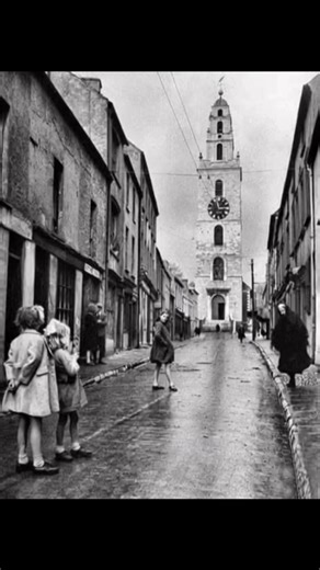 The Shandon bells also known as the four faced liar on a rainy day in 1967 Nestled on a hill overlooking the River Lee in Cork City, the Shandon Steeple—part of St. Anne’s Church—stands as an enduring symbol of Ireland’s vibrant past. Built between 1722 and 1726, this iconic tower replaced earlier churches on the site, with roots tracing back to the 12th century or even earlier. Crafted from red sandstone from the ruins of Shandon Castle and white limestone from a Franciscan Abbey, its pepper-po