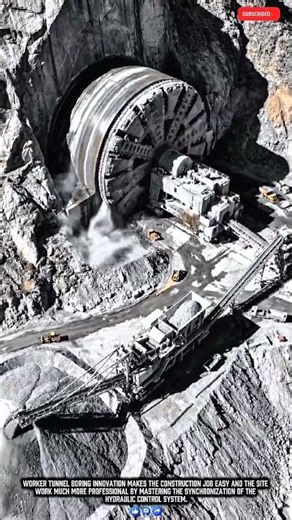 Worker excavating tunnels with a giant TBM machine for stable infrastructure results