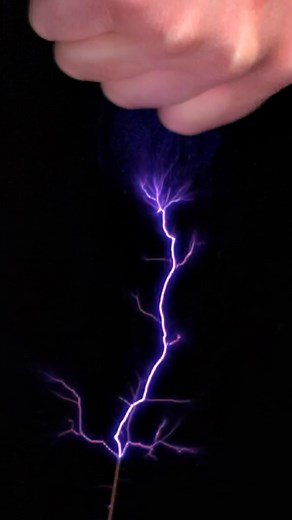 Interacting with a Tesla Coil: Hand vs Electric Current