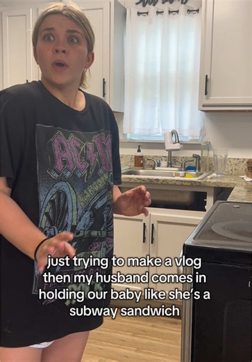 Hilarious Dad Moments: Holding Baby Like a Sandwich