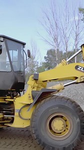 Download Finland,Helsinki - August 22,2022. Scene.Progressive construction on the shore using tractors and trucks.