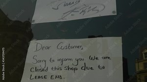 Close up shot of hand written sign of small business closing down due to lease end, London, UK