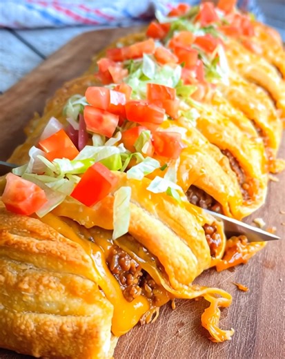 Cheesy, zesty, and baked to golden perfection—this Taco Braid is a fun twist on taco night. With seasoned beef, melty cheese, and flaky braided dough, it’s a family-friendly recipe that’s as delicious as it is impressive. .............. Full Recipe in Coʍmеոτ 💬 | Recipes with Me
