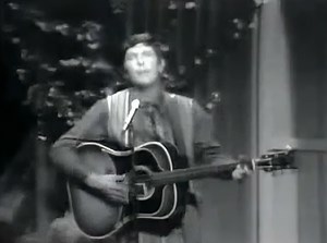 Bobby Helms - Fraulein (Live) (1957) "Fraulein," released by Bobby Helms in 1957, is a poignant country music classic that tells the story of enduring love for a young woman in Germany. Written by Lawton Williams, the song showcases Helms's ability to convey deep emotions, making it a standout track in his career. The narrative, rich in longing and affection, paired with Helms's emotive delivery, draws listeners into a tale of love that transcends distance and time. Musically, "Fraulein" feature