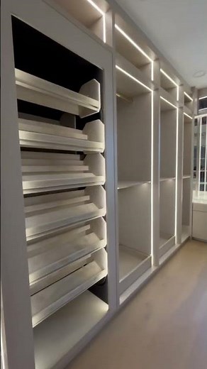 This Rovestry Furniture built closet includes rotating Shoe Carousels from StorageMotion Inc.