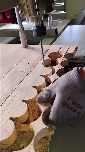 The process of cutting wooden circles on a CNC machine