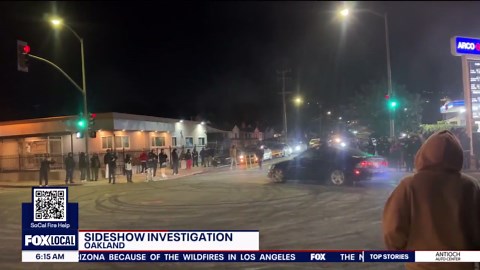 Cars spin at Oakland sideshow