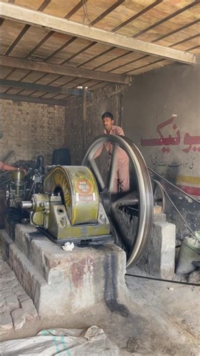 Old black engine working with atta chaki diesel engine