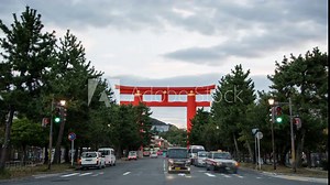 Timelapse.Big Torii Gate above Street with Traffci Stream,Kyoto,Japan