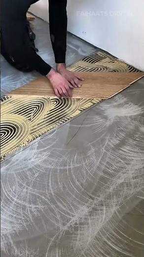 installing diagonal wooden parquet flooring tiles on top of a spread adhesive glue over concrete