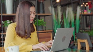 woman using laptop, desktop, computer at co working space,office, cafe, restaurant, home,