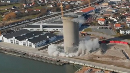 Silo falls wrong way during demolition in Denmark