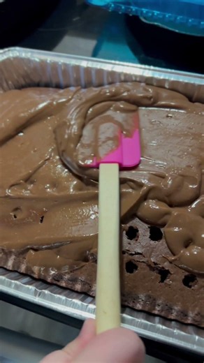 Making a chocolate poke cake using dollar tree ingredients.