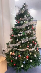 Godaming Library has experienced a Christmas makeover! We had so much fun putting up our tree. 🎄🎄☃️ [Video Description: A video tour of Godalming Library’s Christmas decorations showing a large tree decorated with ornaments, the bookshop covered in silver tinsel, a smaller tree in the children’s library, and a display of Christmas items for sale by the front desk.] | Godalming library