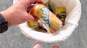 She saves 18 tin cans from the trash for this brilliant garden idea!