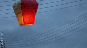 4K People launching asian lanterns during buddhist festival, rice paper hot air balloons are launched during traditional flying lantern from Pingxi in Taiwan-Dan