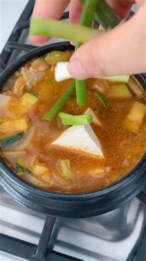 Warm up with a bowl of Korean doenjang jjigae, savory, full of flavor from fermented soybean paste, with soft tofu and hearty vegetables. Ready in under 20 minutes, this tasty stew is comforting and delicious from the very first bite! 😍🥣💕 #koreanfood #dinnerideas #easycooking | Cook With Dana