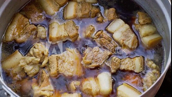 Boil the pork in a pot. Okinawan-style stewed pork cubes, pork belly, stewed in awamori, soy, dashi broth, and sugar.