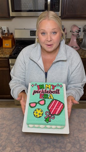 Dani Bell on Instagram: "Pickle ball cake for my mom’s birthday! Perfect for a pickle ball queen 👑 This cake is a lemon cake with a lemon meringue buttercream and glazed strawberries! Who thinks we need a pickleball set of cake templates?! 🙋‍♀️ #cake #cakedecorating #pickleball #pickleballcake #birthdaycake #cakesandwich #cakewich #printedcakes #cakeart #cakes #cakeideas #cakestyle"
