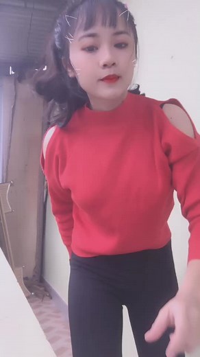 Expressive Movements in a Red Cut-Out Top Performance