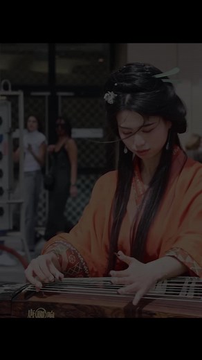 Jingxuan Guzheng Street Musician Playing Zither Instrument in Public