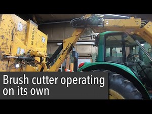 John Deere machete brush cutter functioning on its own