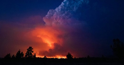 Western wildfires rage across 12 states, U.S. at highest alert level