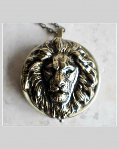 Lion music box locket, round locket with music box inside, in bronze with lion.