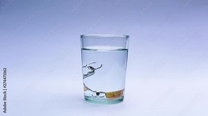 Clean and disinfect denture by putting a tablet to denture in a glass filled with fresh water
