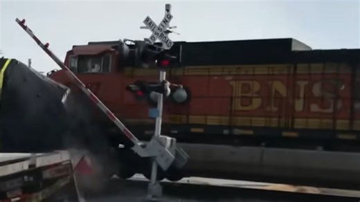 Train slams into a flatbed truck in a brutal crossing crash
