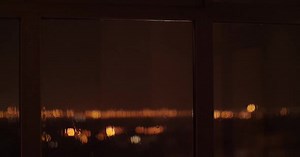 Slow Motion Lightning and Rain Through Window at Night