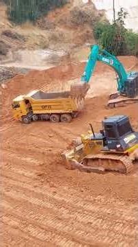 Excavator Loading dumpers bulldozer in action heavy equipment videos