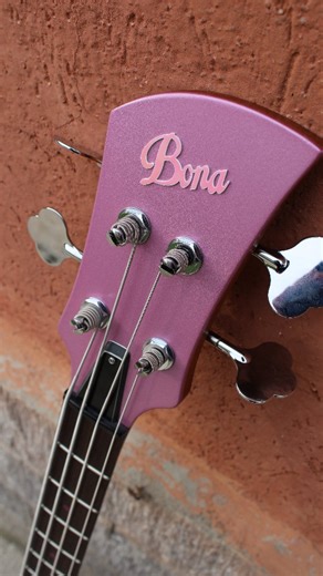 Bona | custom guitars made in Italy on Instagram: "Here are some close-up shots of the new custom bass built for @rsammarelli .🩷 It all started with specific needs: a comfortable and cool instrument with a distinctive, powerful sound. Balanced, easy to play, and lightweight. An ambitious and challenging project. Now that it's finished, I can only be happy because it has exceeded every expectation! ✨✨✨ #bonaguitars #robertasammarelli #custombass #boutiquebass #electricbass #bassplayer #bassmaker