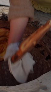 Savor the traditional art of baking bread in a rustic clay oven, where each perfect loaf reflects care and tradition. #BreadBaking #ClayOven #TraditionalCooking #Cooking | FV Stories