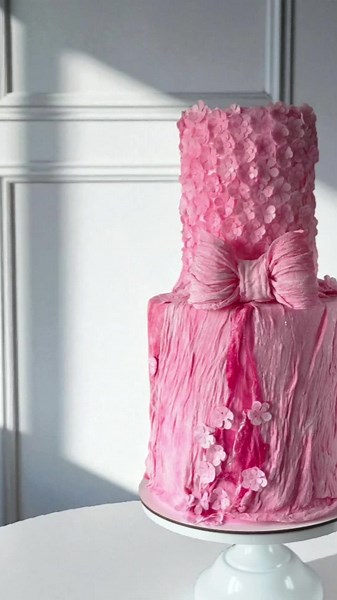 My name is pink and I'm really glad to meet you 🎀 This stunning two tier cake is made with crepe paper, veil and floral details 🌸 all absolutely edible #foru #foryoupage❤️❤️ #foryoupage #fyp #pinkcake #weddingcake