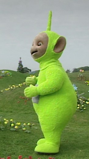 Dipsy Teletubby Encounters a Colorful Butterfly