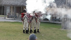 This is a musket firing demonstration at Colonial Fort Michilimackinac in Mackinaw City. For people wanting to take a still photo of them going off, the staff receomend resting your finger on the shutter and most people flinch and take the photo as they discharge. | MightyMac.org - The Mackinac Bridge & Straits of Mackinac