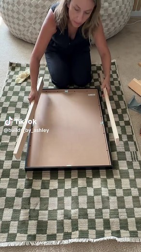 Earlier mornings are officially here now that my oldest is in middle school, so I built this hidden picture frame cabinet to save our bedtime routine! 🤫 How I made it 👇 Built a shallow box to fit behind our frame using a 1x3, screws, hinges, and a catch magnet. Filled the holes, sanded, and painted it to match. Mounted it securely into the studs! We keep our @OLLY Wellness Kids Sleep gummies in here for whenever the kids are feeling too giddy at bedtime to be back in school 😴 Would your kids