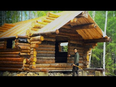 Rustic log cabin roof build family visits secluded forest 2.