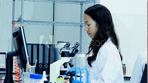 Team Scientists working in a laboratory together. 4K Resolution.