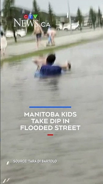 Manitoba kids take dip in flooded street after rainstorm on June 9, 2026