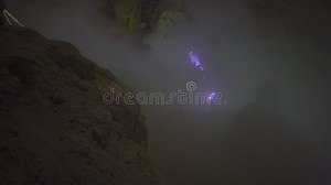 A Natural Phenomenon Known As `Blue Fire` Seen through Volcanic Gasses Coming Out of the Ground at the Ijen Volcano on Stock Footage - Video of mountain, kawah: 164477738
