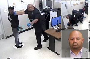 Michigan officer charged over video of him punching, slamming man being booked into jail