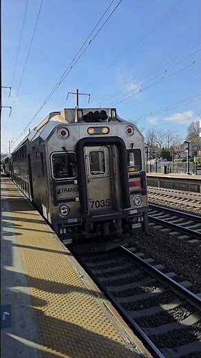 NJ Transit train led by Bombardier Cab Car 7035 arrives at Metropark